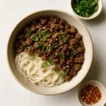 low fodmap beef and noodles in a ceramic bowl